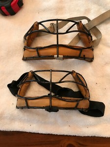 TWO WINTAGE BASEBALL OR OTHER SPORTS WIRE AND LEATHER MOUTH PROTECTOR CAGES.
