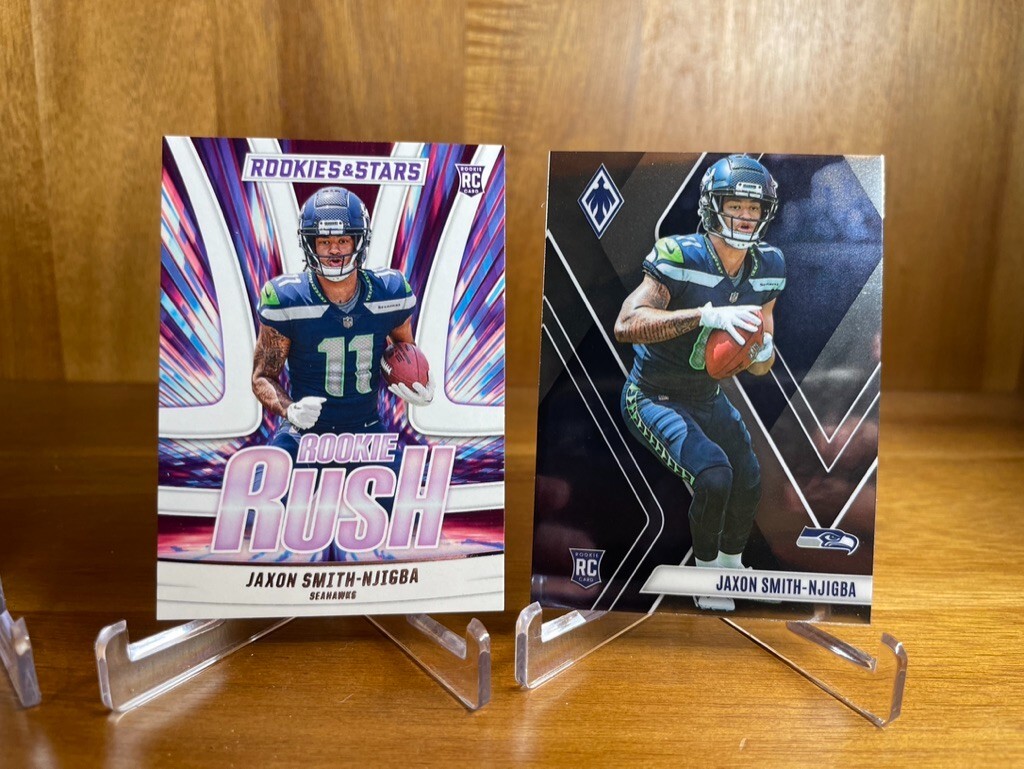 Jaxon Smith-Njigba 2023 Rookies & Stars Rookie Rush #RR-9 + Phoenix #106