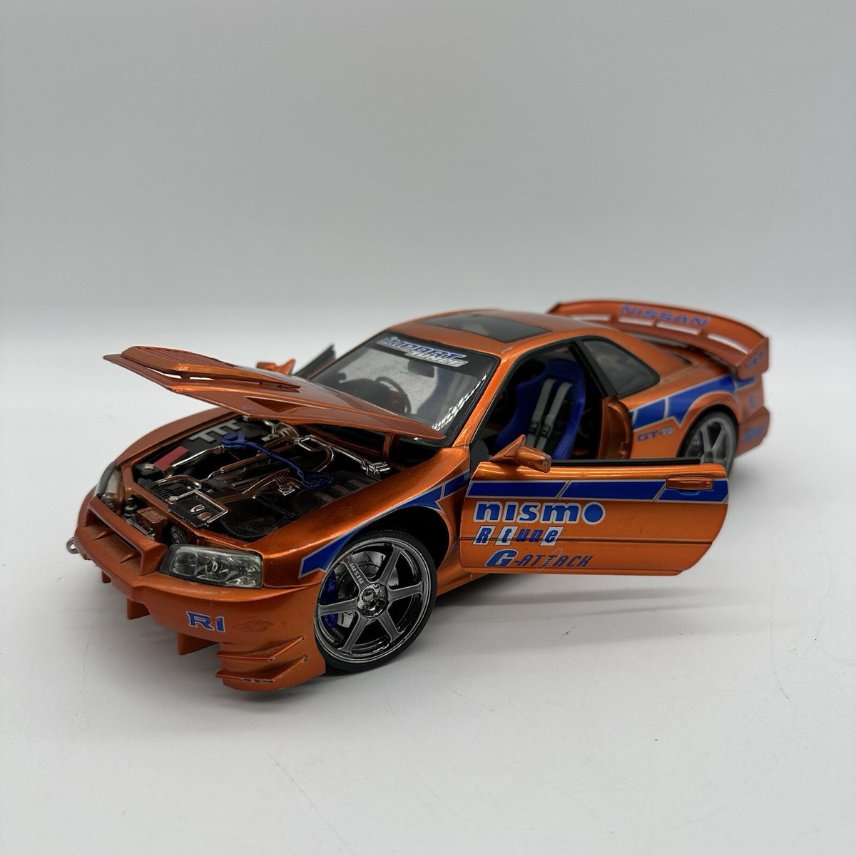 Muscle Machines Import Tuner 1/18 Scale 2000 Orange Nissan Skyline