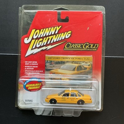 Johnny Lightning 1997 Ford Crown Victoria Taxi Classic Gold Diecast 1:64 Yellow