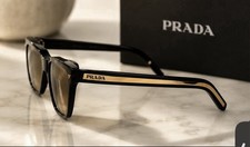 PRADA SPR 815 women Oval Sunglasses Black Frame Brown Lenses 145mm