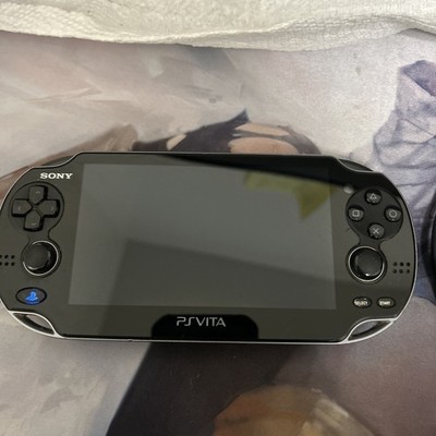 Sony PlayStation PS VitaPCH-1100 Black w/ Game