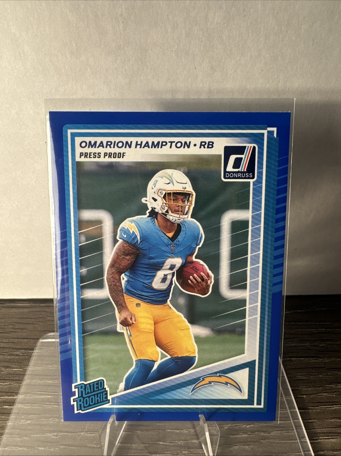 2025 Panini Donruss Rated Rookie Omarion Hampton Press Proof Blue RC