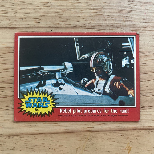 1977 Topps Star Wars #84 Rebel pilot prepares for the raid! — Raw