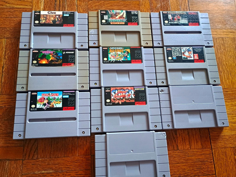 Nintendo SNES Game Lot: Super Mario All-Stars, Street Fighter II, Monopoly, Clue