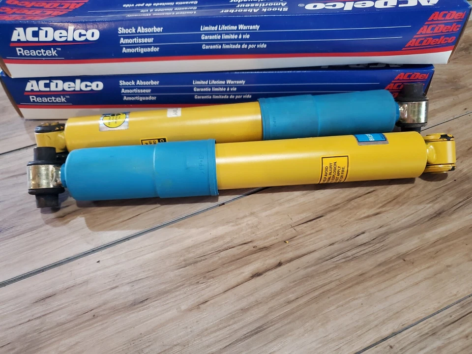PAR (2) AMORTIGUADORES DELANTEROS NOS OEM K2500 K3500 CAMIÓN CHEVROLET GMC Foto 2 de 4