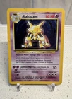 Pokemon 1999 Base Set Alakazam Unlimited Holo #1/102 - DMG