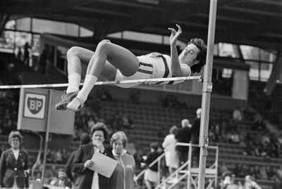 British athlete Barbara Inkpen competes in high jump at an athleti- Old Photo