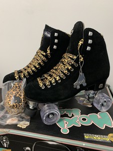 black suede roller skates