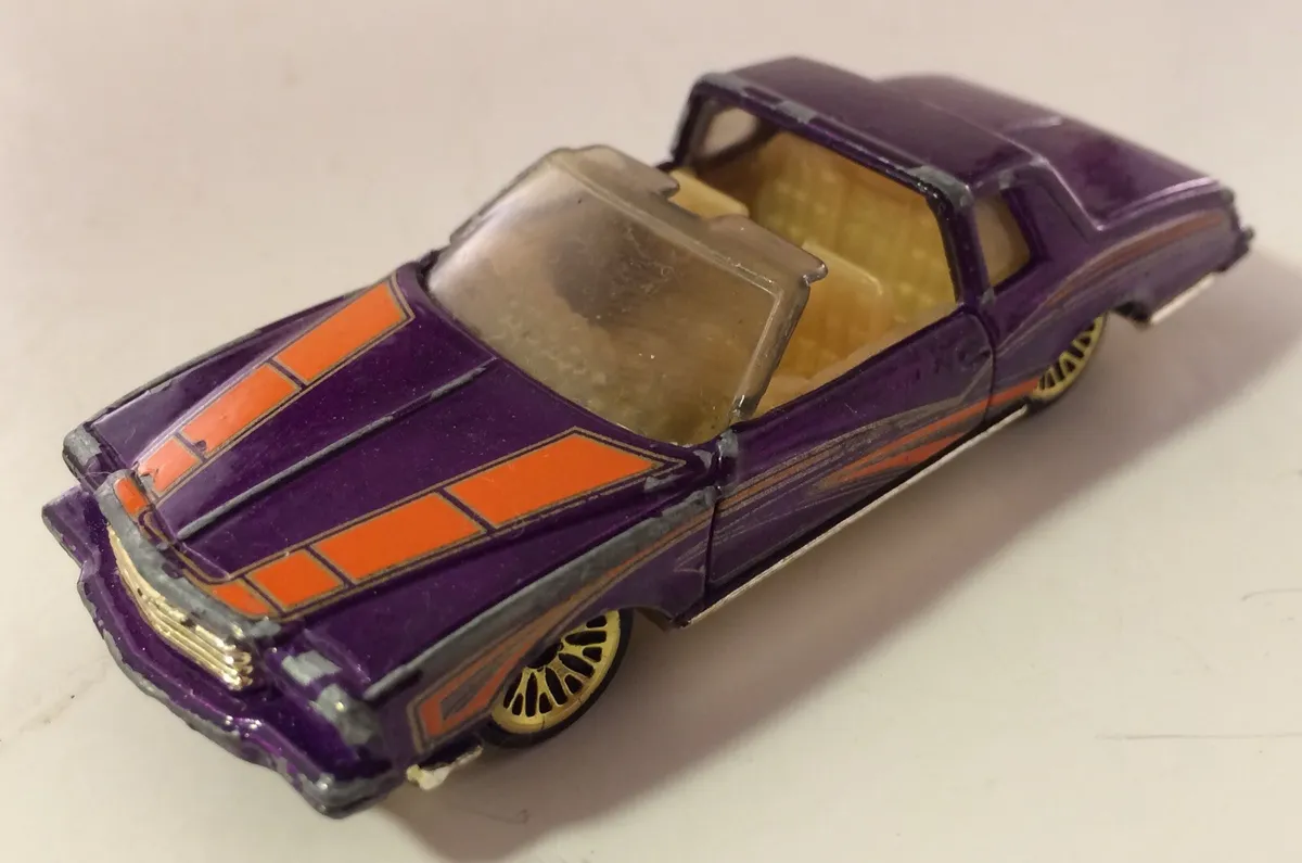 Hot Wheels 2001 Purple / Orange Stripe Montezooma GMTM 1:64 Diecast Car -  RARE