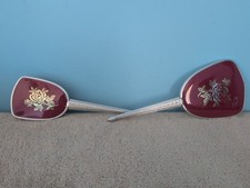 Vintage vanity set featuring a hand mirror and matching brush