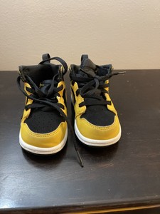 black and yellow infant jordans