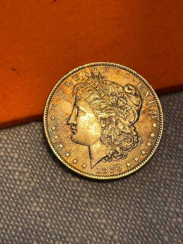 (#101135) Morgan Dollar:  1883 O.  BU.  Rainbow toning.