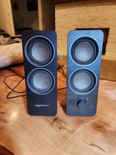 Amazon Basics AC Powered multimedia computer speakers with auxiliary plug in.