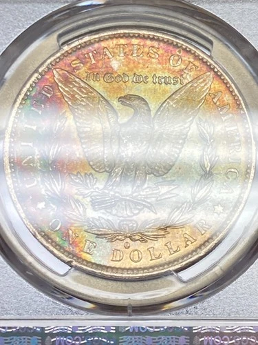 1883-O PCGS MS62 Morgan Dollar w/ Gorgeous Rainbow Toning & Amazing Eye Appeal
