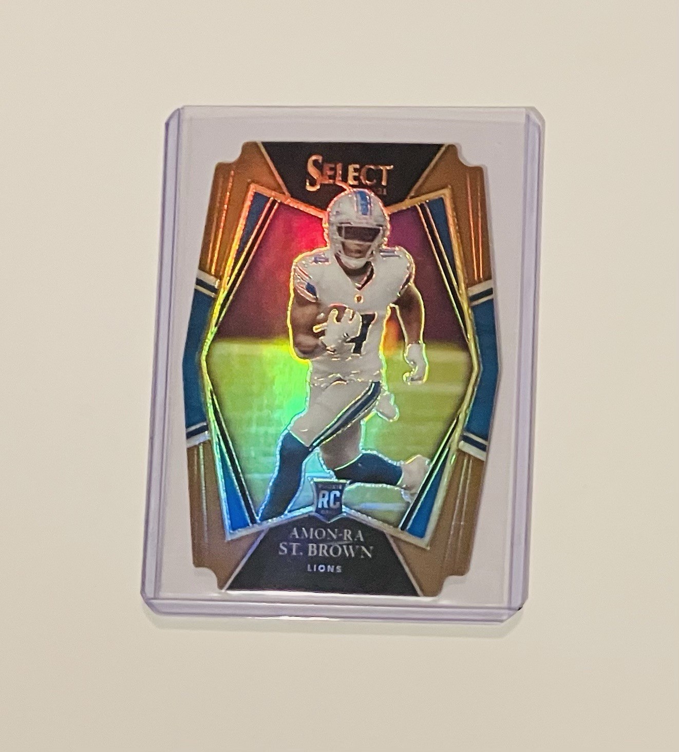 2021 Panini Select Premier Level Amon-Ra St. Brown #173 (RC) Copper Die-Cut /199