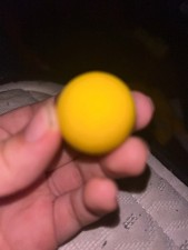 Small yellow foam ball with a hole and no brand used and is in good condition
