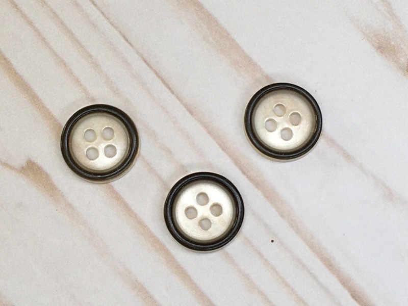 Clear/ black raised edge - 4 hole buttons- 5/8”- set of 3