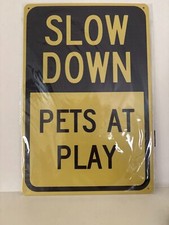 SLOW DOWN PETS AT PLAY METAL SIGN