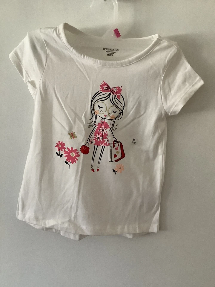 CAMISETA NIÑA BLANCA PIEL DURA NIÑA CON VESTIDO ROSA Y LAZO M 5/6 NUEVA CON ETIQUETAS Foto 2 de 2