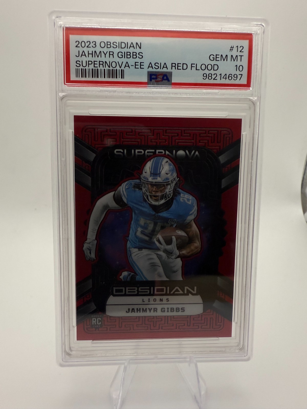 Jahmyr Gibbs Panini Obsidian Supernova #12 Electric Etch Asia Red Flood
