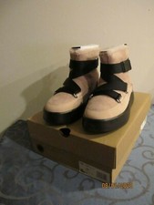 UGG Australia Women's Classic Boom Buckle Combines Sneaker and