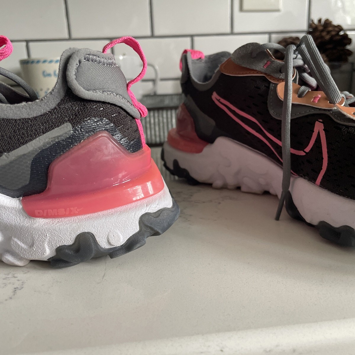 pink and grey nike react
