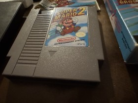 Carro Super Mario Bros 2 NES casi nuevo, caja sello ovalado caja Rev-A y manual (Dmg)