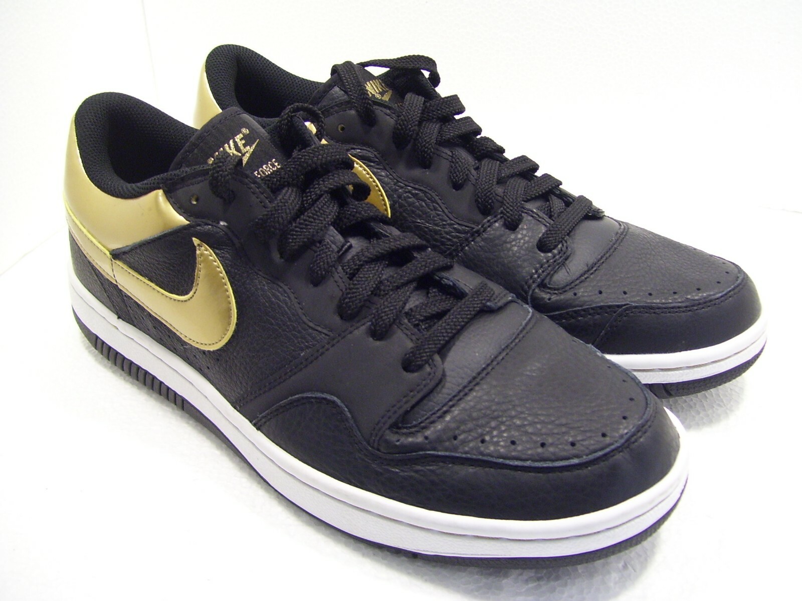 black and gold nike runners