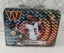 2025 PANINI REVOLUTION JAYDEN DANIELS SEALED LUNCH BOX TIN