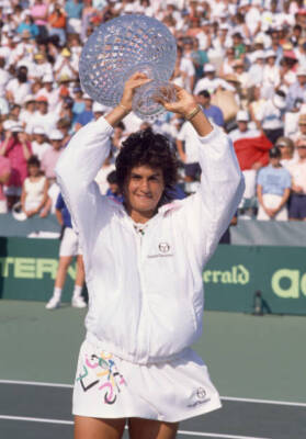 Gabriela Sabatini of Argentina lifts the trophy after defeating C - Old Photo