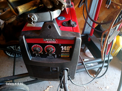 Red Lincoln Electric Welder. It can Weld Steel. It runs on Ac/DC power.