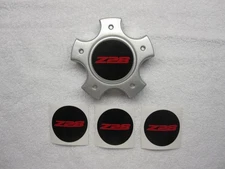 Center Cap Decals - Black W/ Red Letters, Fits 2-1/4" Diameter