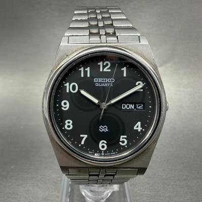 Seiko SQ watch Men 34mm Black Dial Silver Tone Daydate 5Y23-7000 