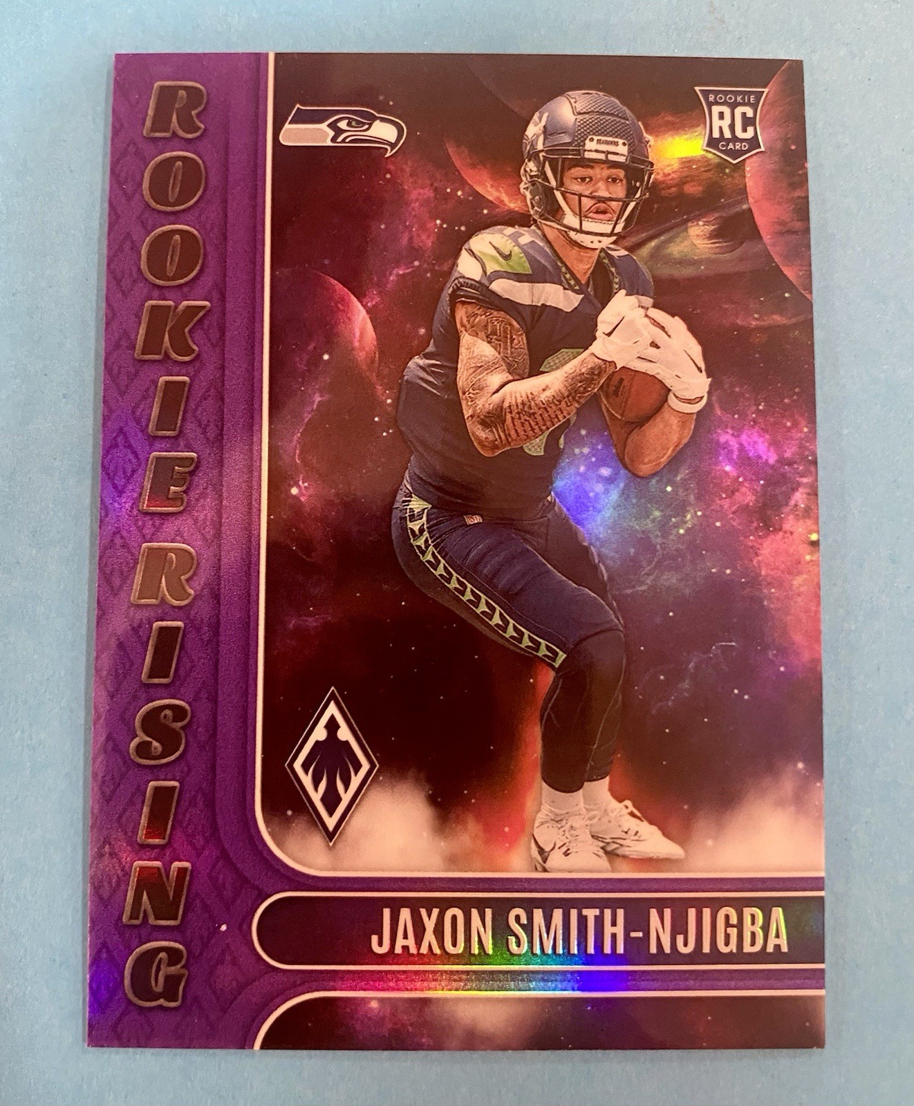 2023 Phoenix /125 (RC) Jaxon Smith-Njigba #RIS-9 Rookie Rising Purple Seahawks