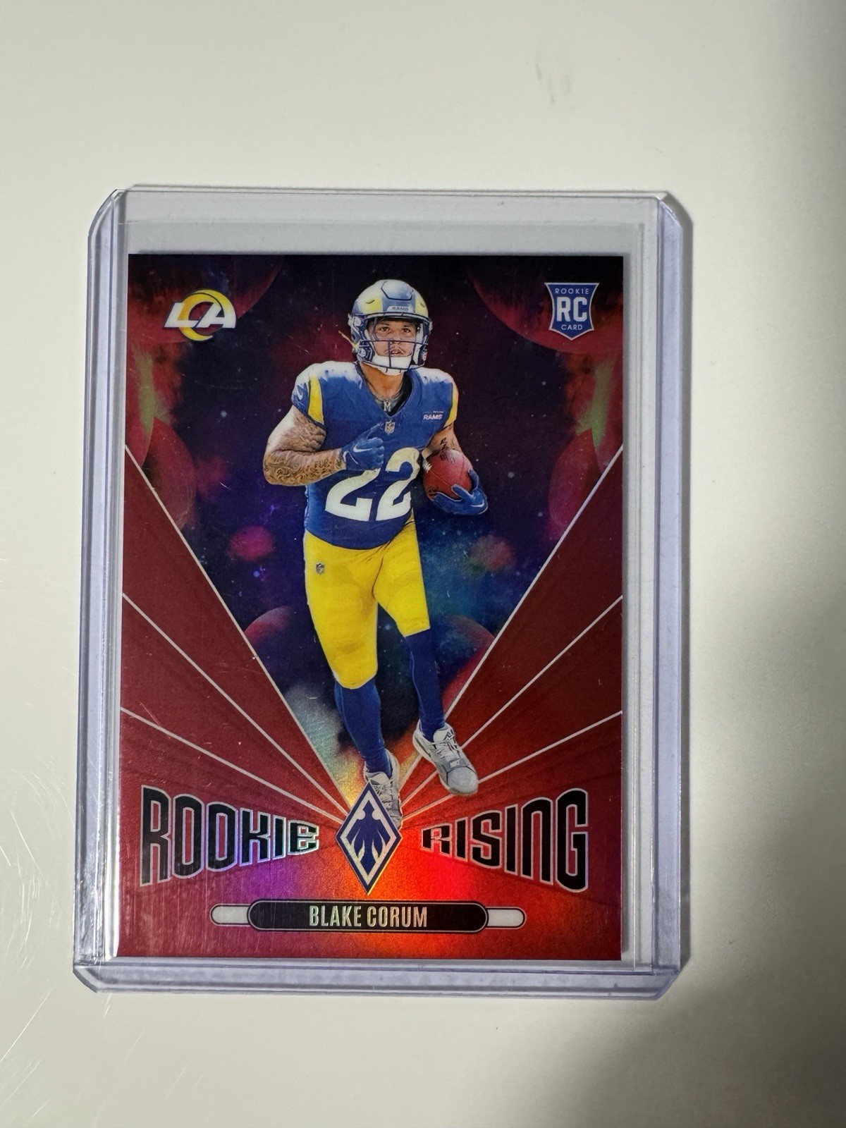 2024 Panini Phoenix - Rookie Rising Blake Corum #RR-BCM Red /99 (RC)