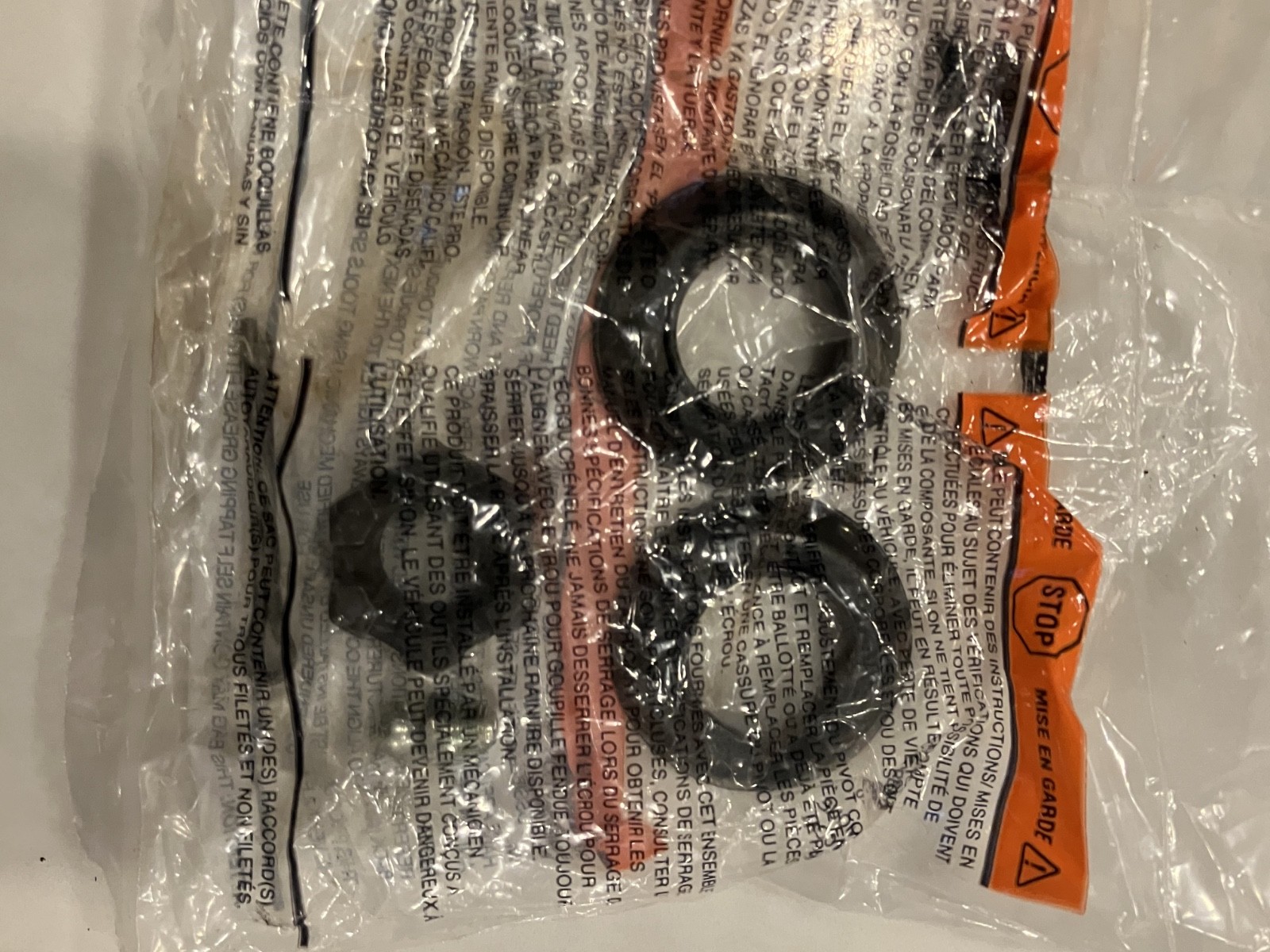 Lower control arms 1967 Ford Mustang in clear bag with black roller and orange “MADE IN USA” text on white label.