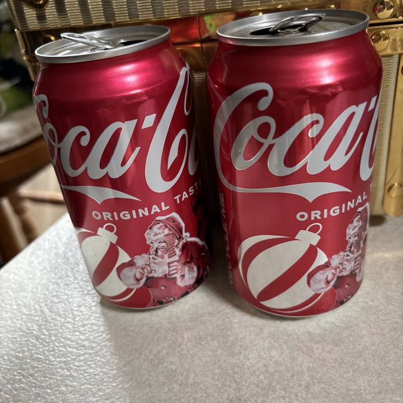 Empty 2025 Santa Claus Coca-Cola Cans