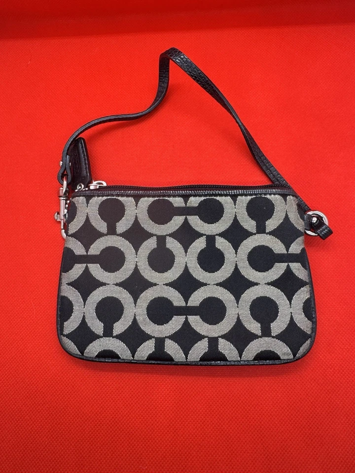 Muñequera Coach Op Art Madison patrón de firma negro y gris con cuero negro Foto 2 de 3