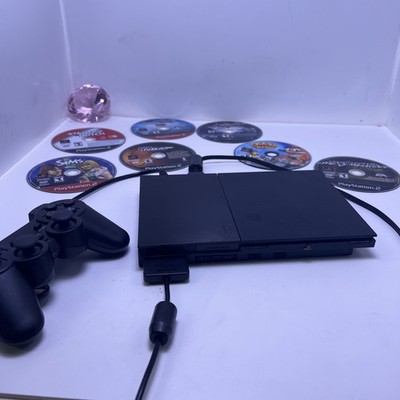 ps2 slim with 1 controller/power/av cord/ 8 loose games works perfectly