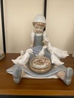 Lladro Figurine #5074 "My Hungry Brood" (girl with ducks sitting on the ground)