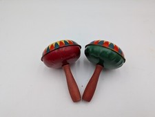 2 Vintage Tin Litho Rattlers Noisemakers T COHN Wood Handles Yellow Green Red