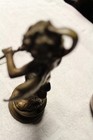 Vintage Brass 7.5" Flute Player with Swan on his back & head of swan on his head — photo 10