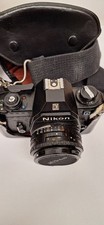 Nikon EM 35mm film camera with 50mm f1.8 Series-E lens  cover