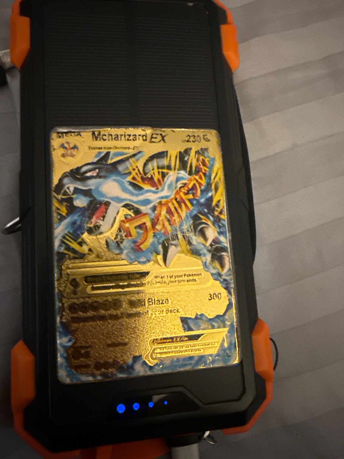 gold mcharzard pokemon in fair condition moderately played with