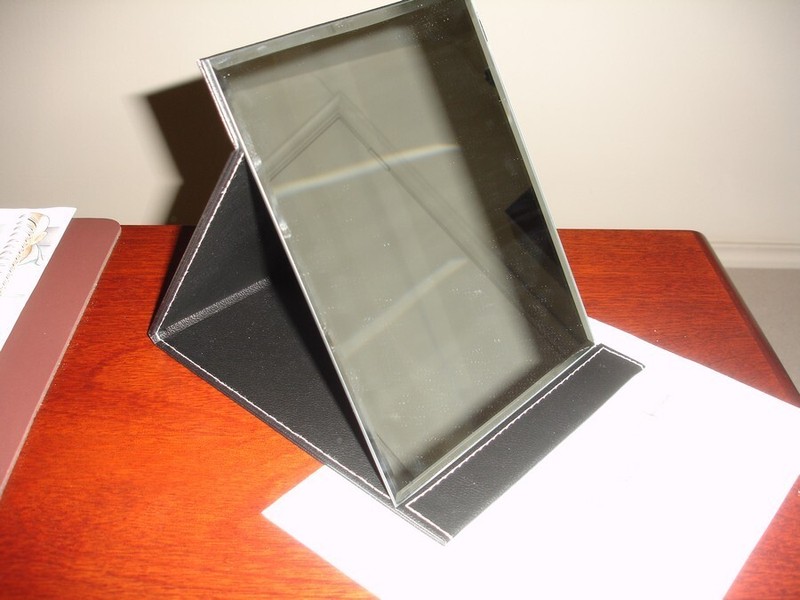 Folding travel make-up mirror, 8 1/2" tall X 7 1/2" wide, no magnification