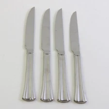A Set of 4 Reed & Barton Brookshire Stainless Solid Handle Steak Knives 9.75 In