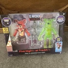Jazwares Vault Five Nights at Freddy’s Endo-01 & Radioactive Foxy FNAF IN HAND