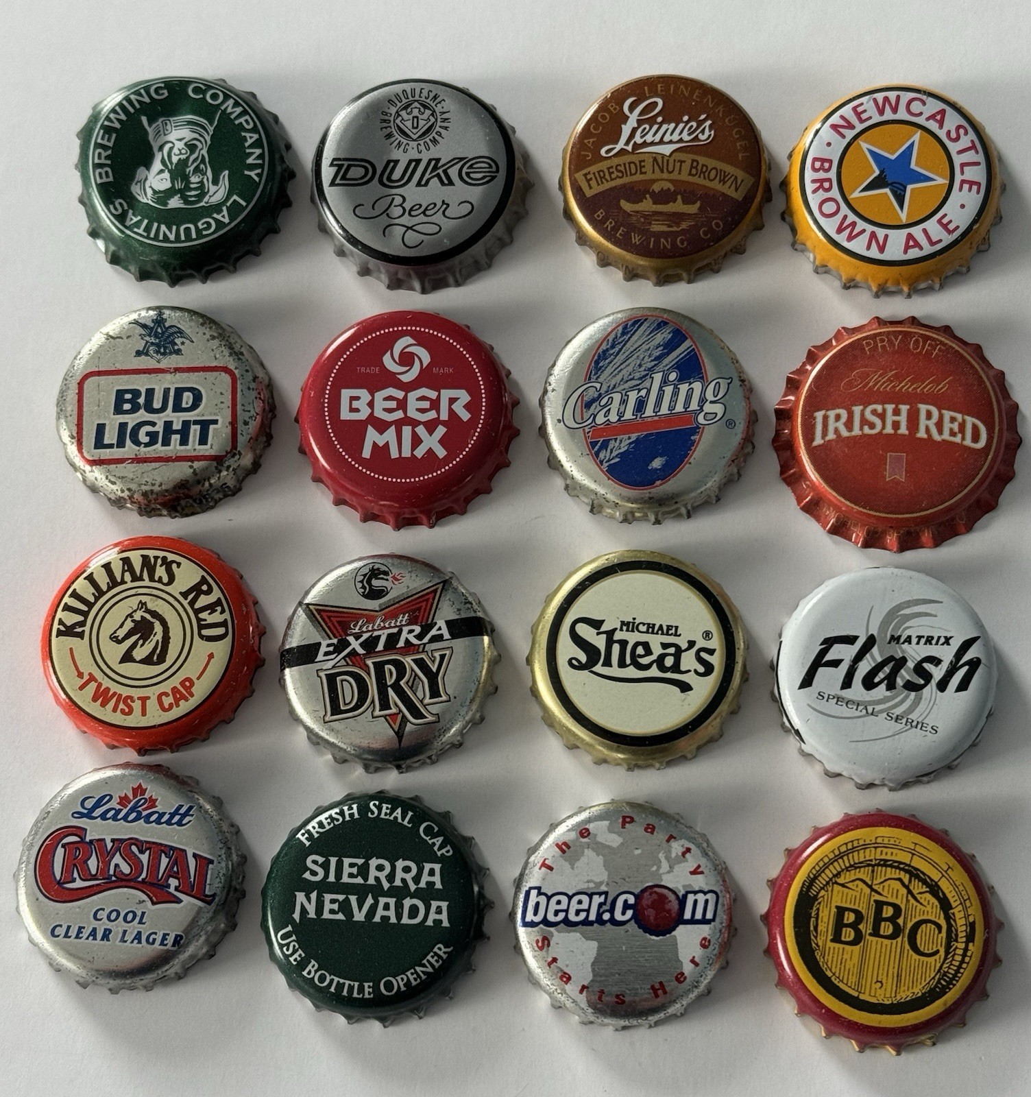 Lote de tapas de cerveza Killian's Red Crystal Duke Sierra Nevada Carling Flash Shea's usadas