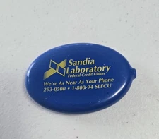  Quikoin Blue Oval Rubber Squeeze Coin Purse Sandia Laboratory USA (wear)